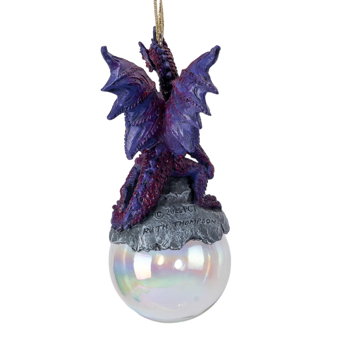 Ornament with purple dragon on rock on iridescent bubble. Shown from the back