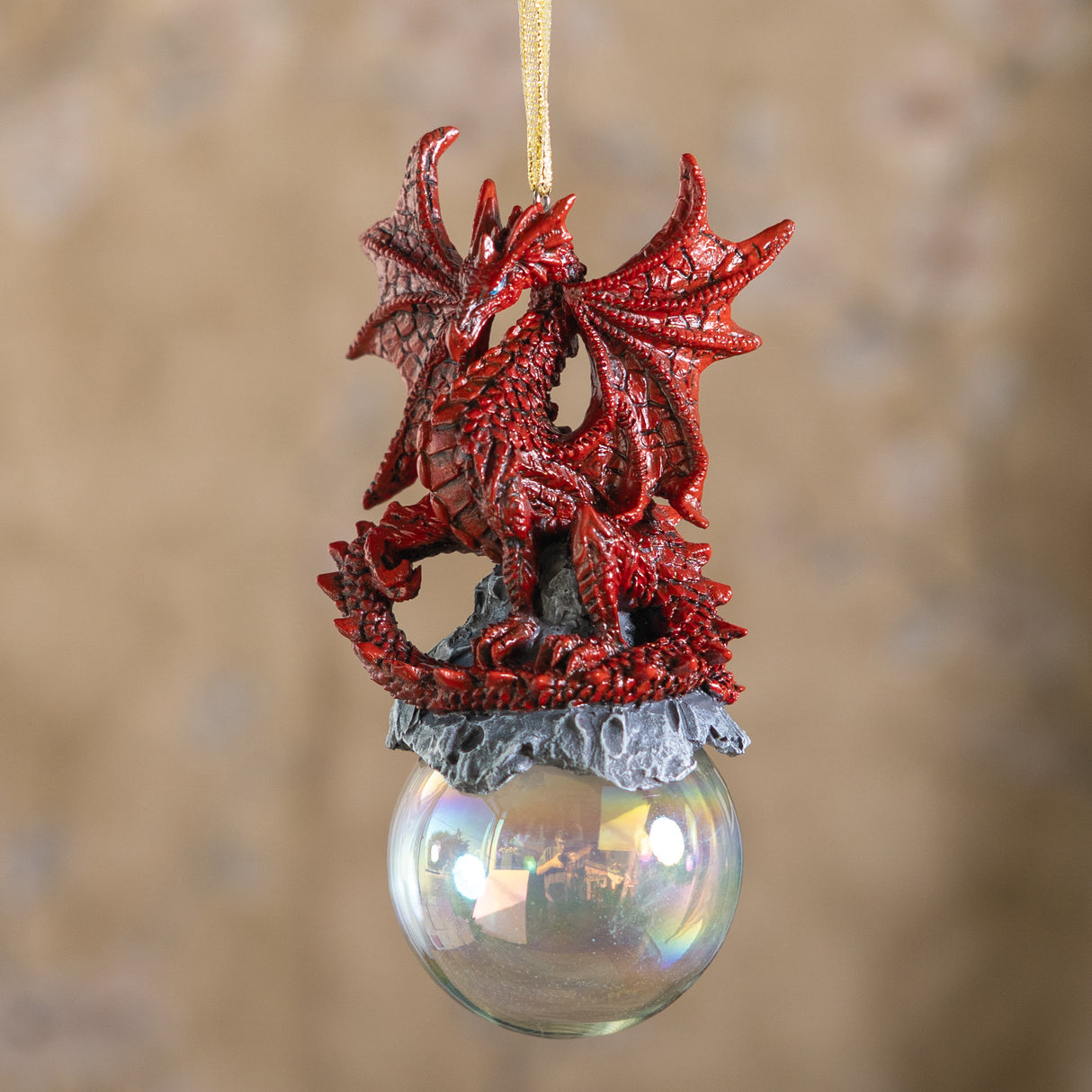 Red dragon ornament on rocks on a glass orb bubble