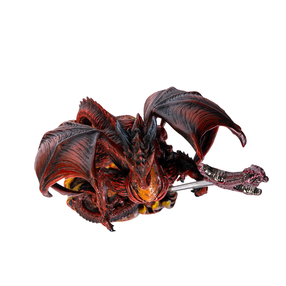 Red and orange dragon figurine holding a sword letter opener amidst flames, shown top down