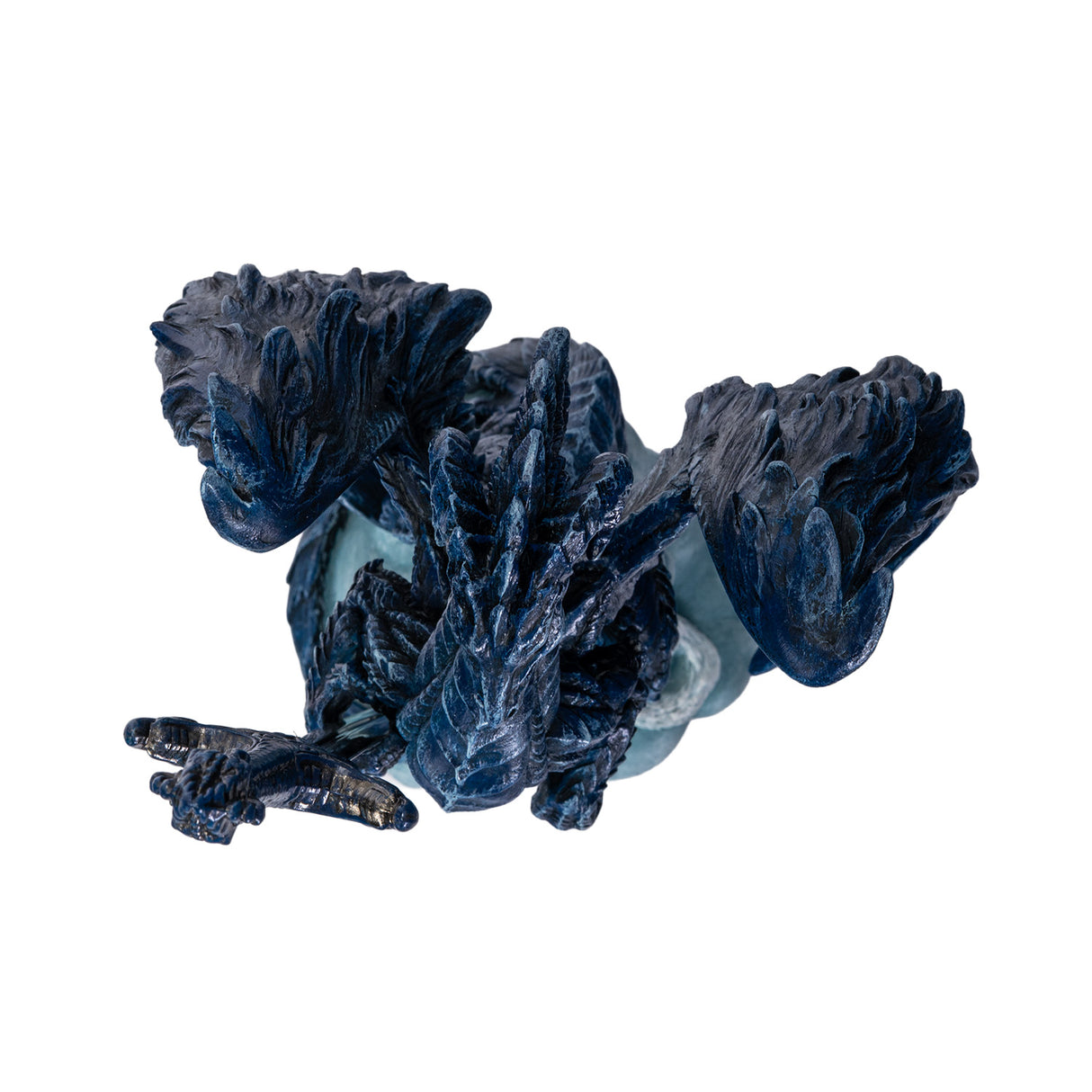 Blue dragon figurine holding a sword letter opener with a white wolf at its feet shown top down