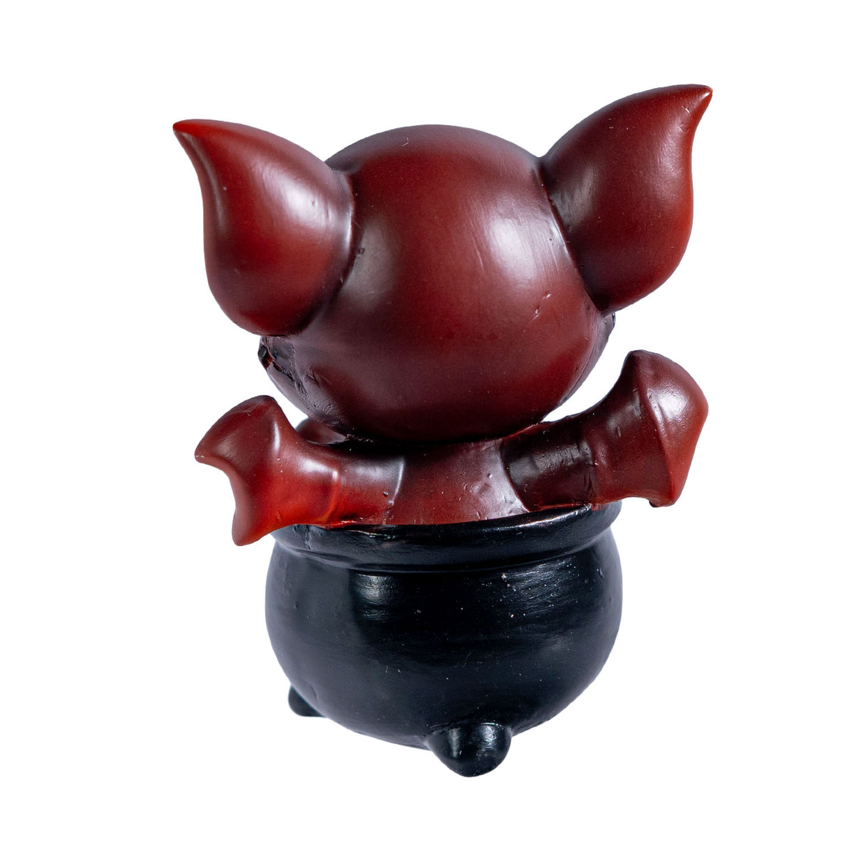 Red dragon imp in a black cauldron figurine. Shown from the back