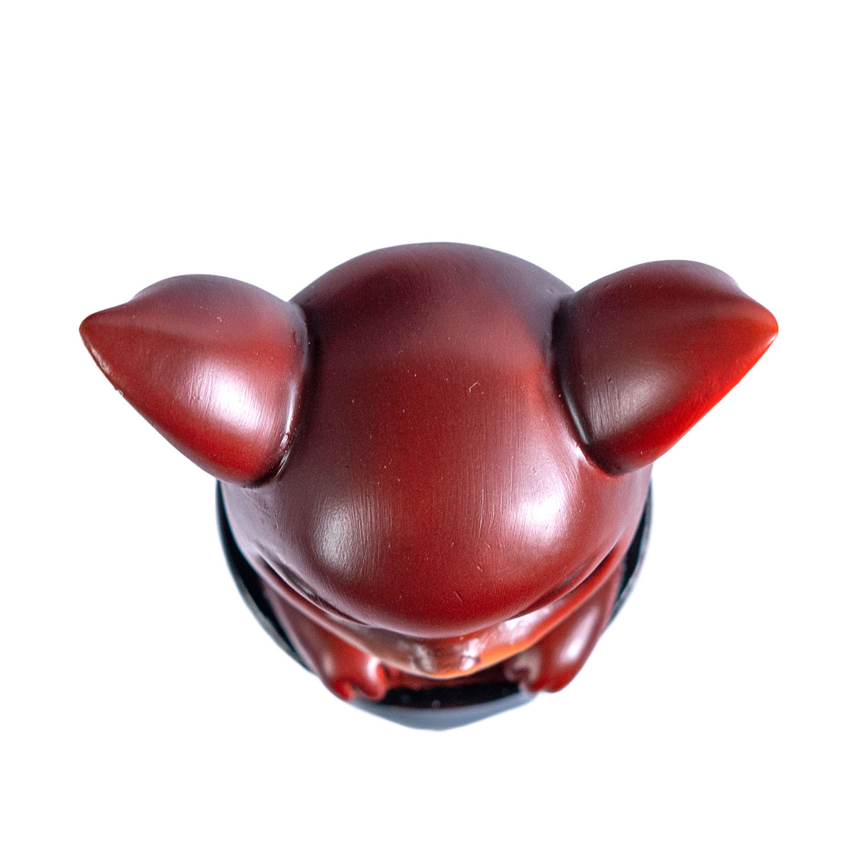 Red dragon imp in a black cauldron figurine. Shown top down