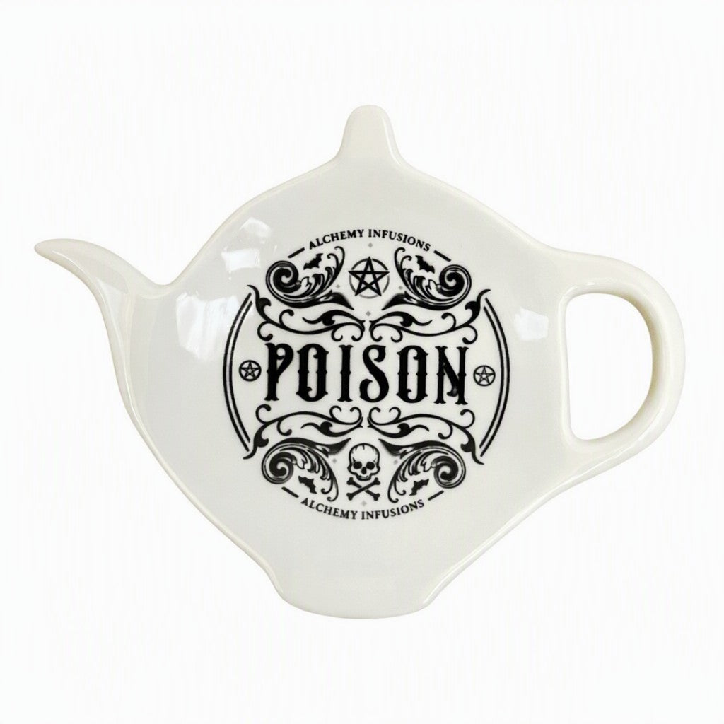 White ceramic teapot-shaped spoon rest with "Poison" motif and spooky designs