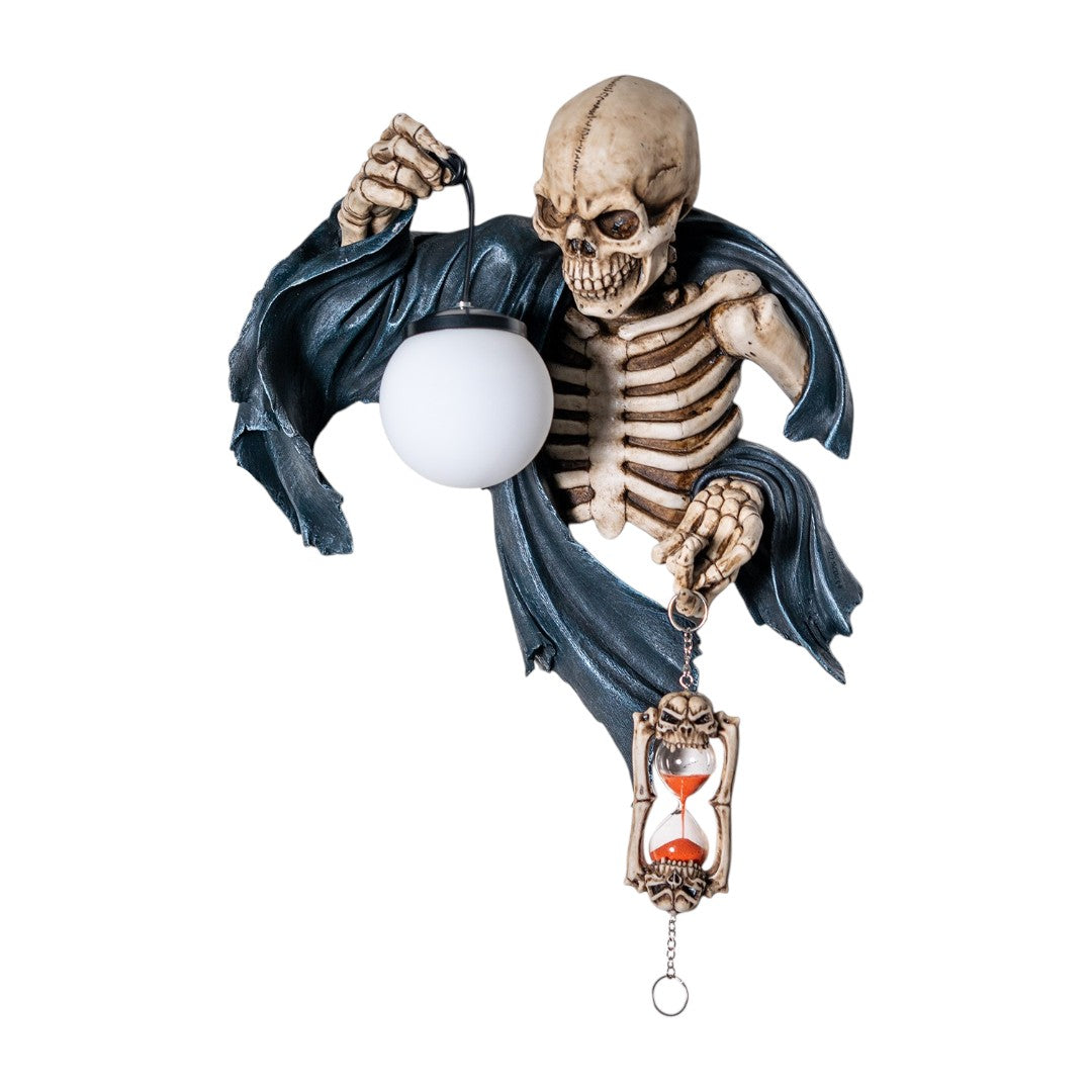 A wall lamp featuring a skeleton in black torn robe holding an orb light in one hand, hourglass in the other