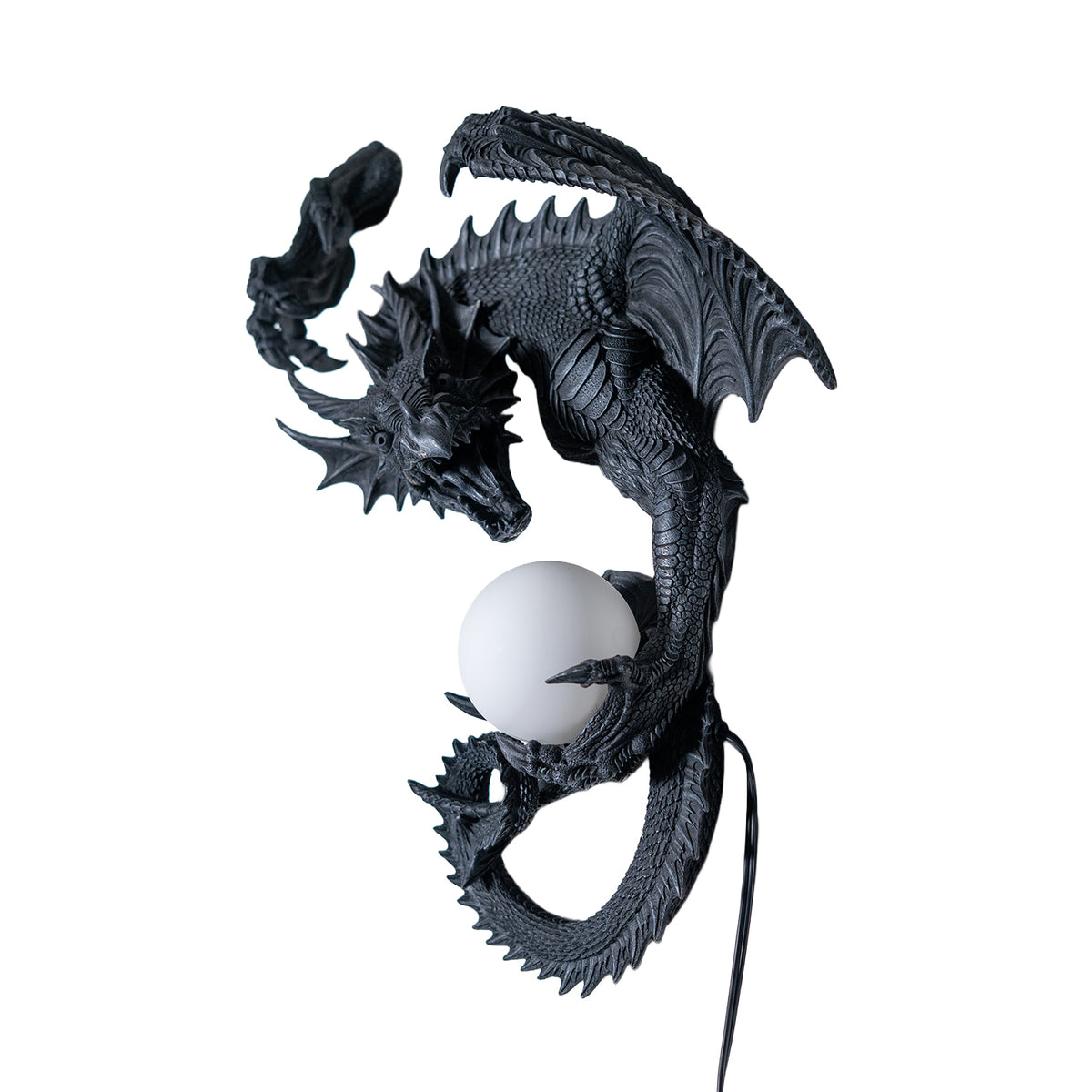 Dark gray faux-stone wall mounted lamp shaped like a dragon with an orb that glows