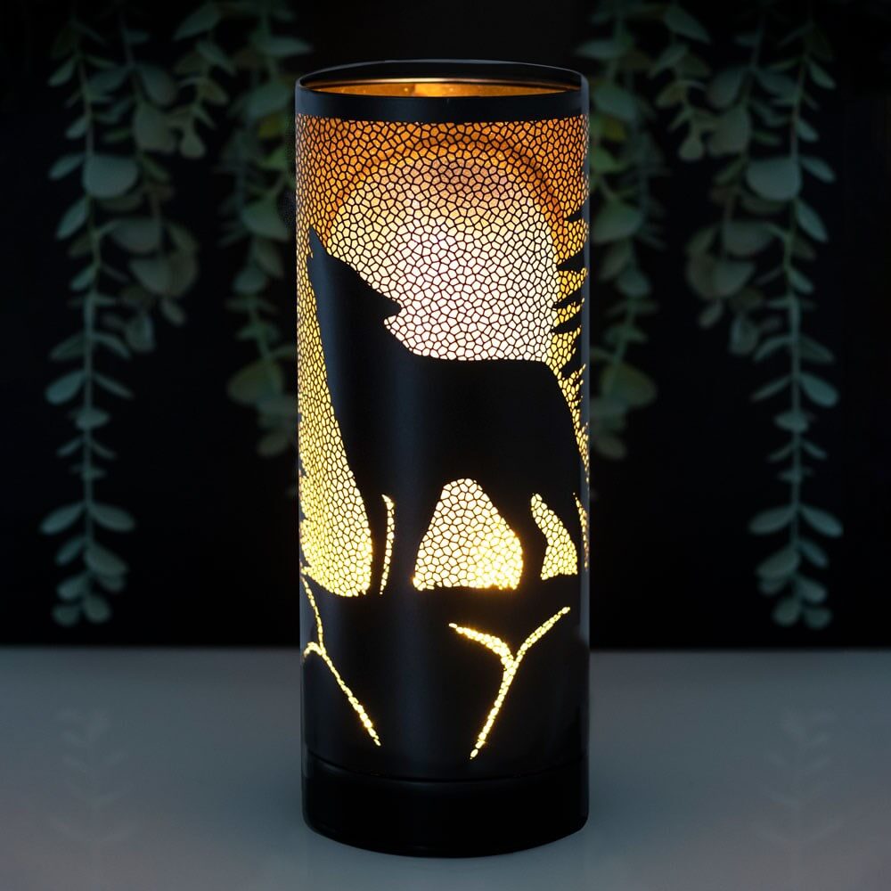 LED aroma lamp with silhouette of a wolf on orange backdrop