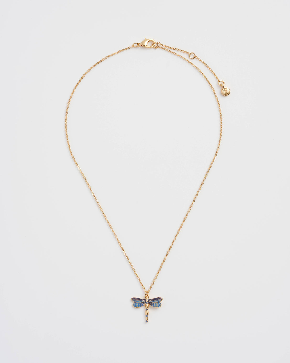Gold necklace with a dragonfly pendant