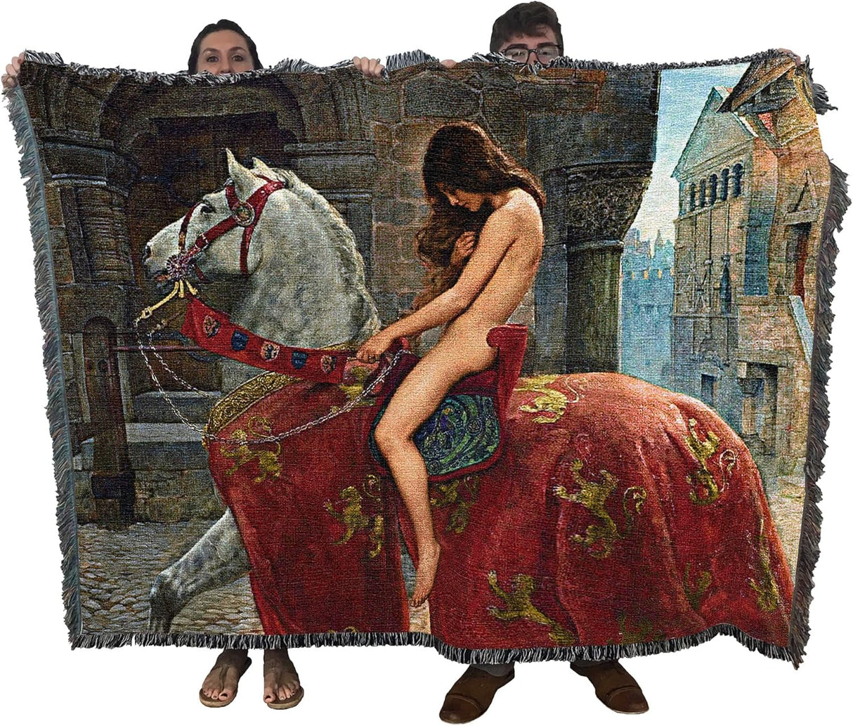 Tapestry blanket showing the legend of Lady Godiva riding through the streets on her horse. Held up by two adults to show large size