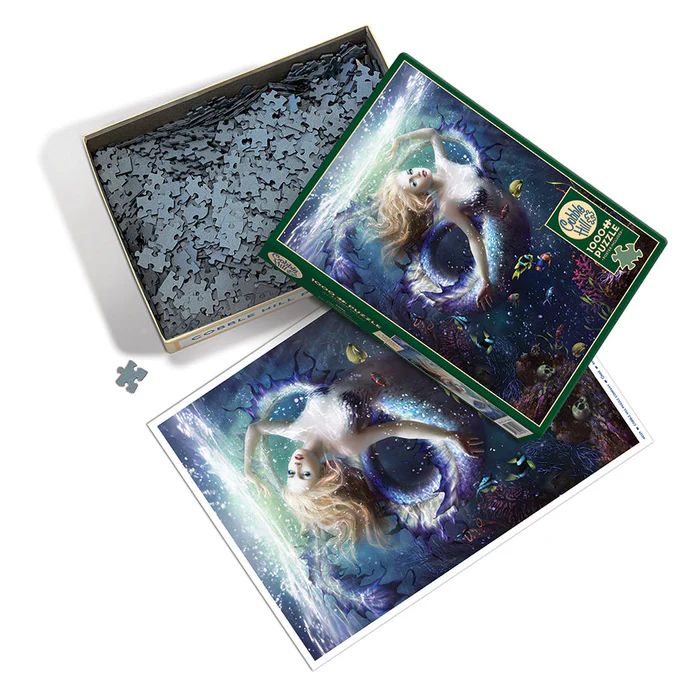 Cobble HIll 1000 Piece Puzzle, Poster Included - Mermaid surrounded by fish and coral, just about to break the surface of the water. Box shown with pieces and poster
