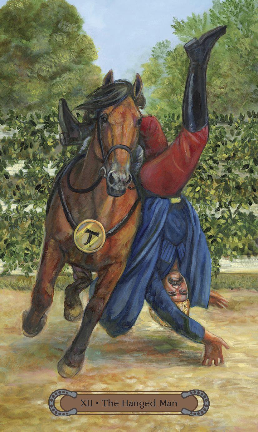Unbridled Spirit Tarot Deck & Guidebook set - The Hanged Man card with bay horse nd man half off the horse