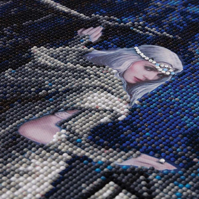 Closeup of crystal art painting with white-haired woman