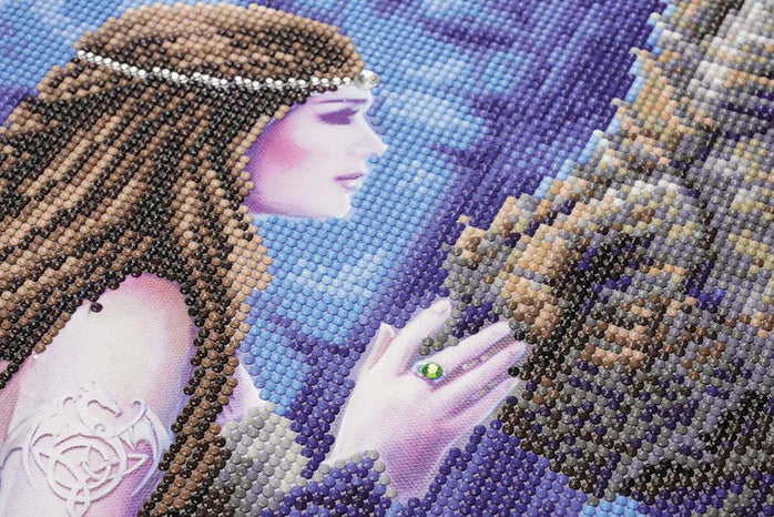 Closeup of crystal art woman touching dragon's nose