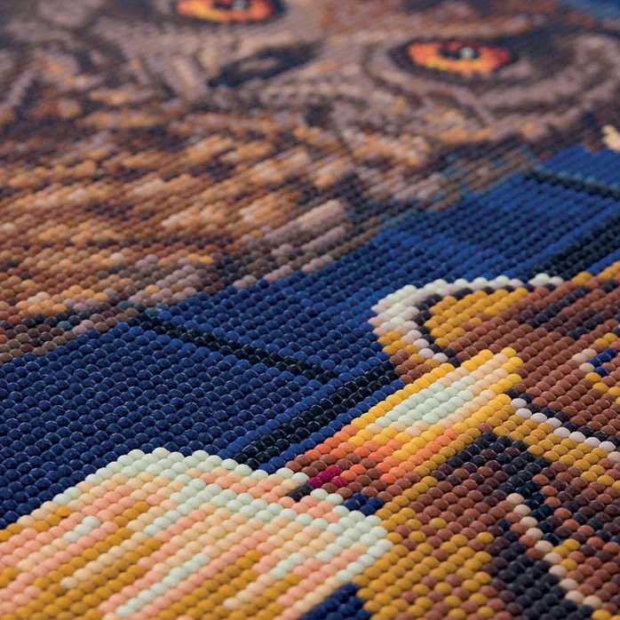 Closeup of crystal art owl and candle