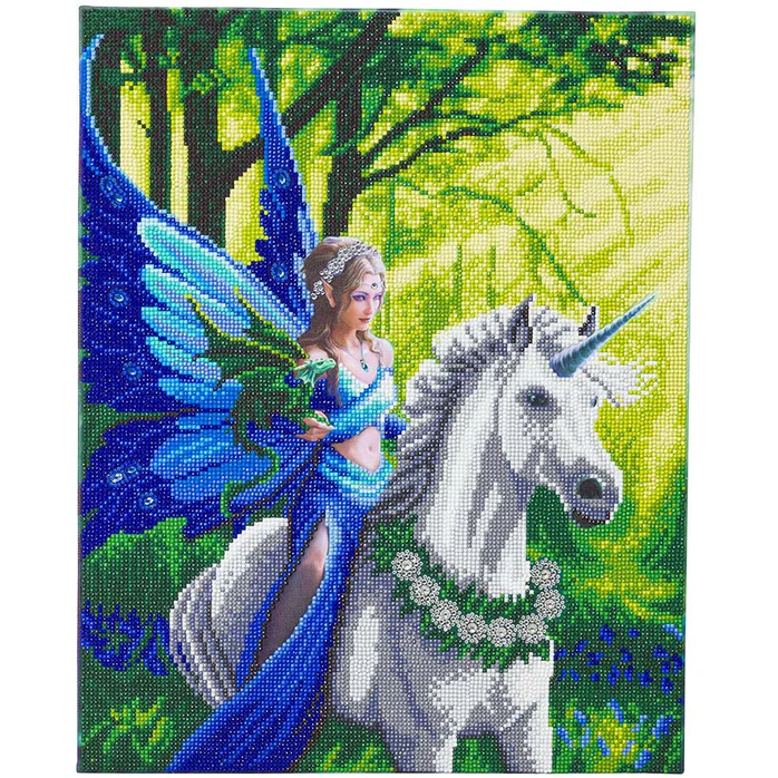 Crystal art image of a fairy with blue dress and wings riding white unicorn through a forest with green dragon on arm
