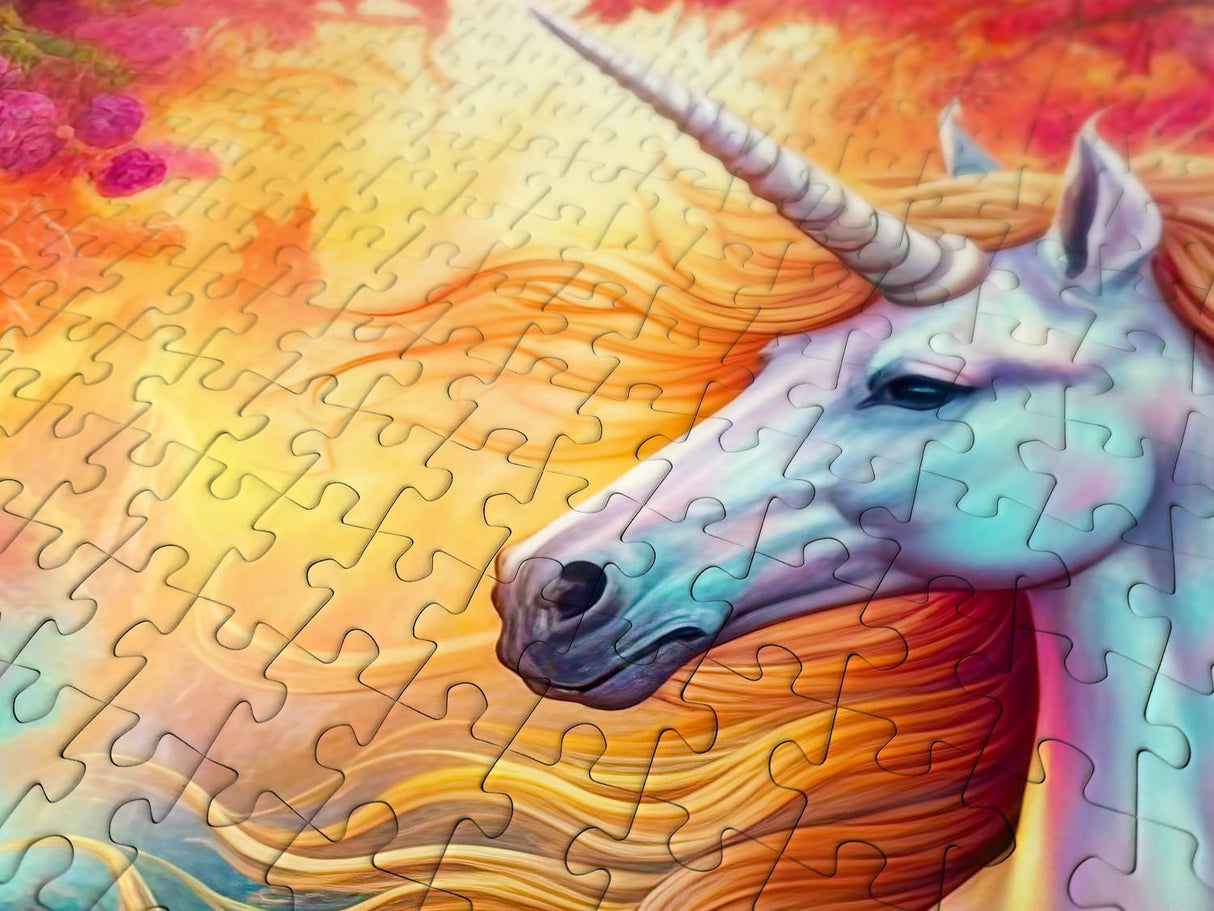 Closeup of puzzle pieces, unicorn and sunset backdrop in fiery shades