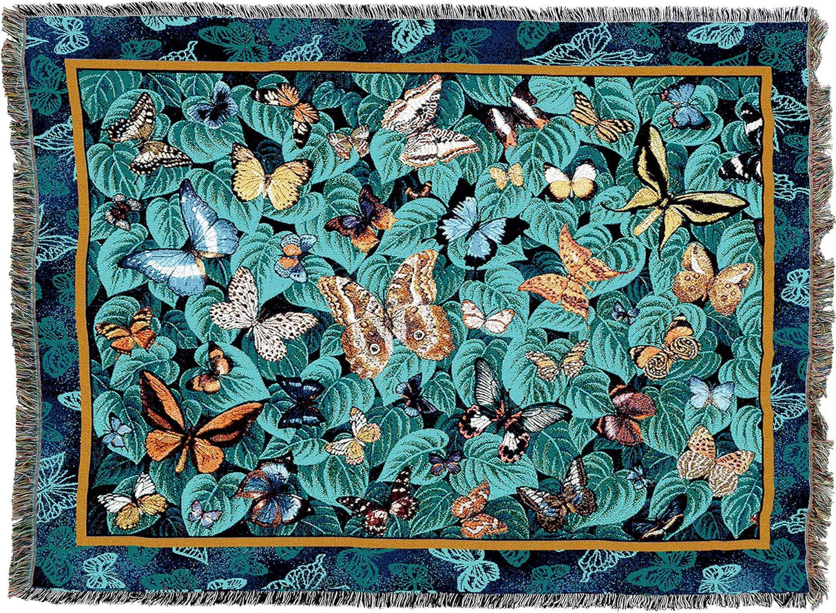 Woven tapestry blanket featuring various butterflies on a green-teal leaf background