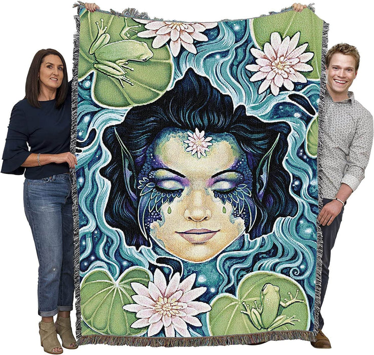 Tapestry blanket held up by two adults to show large size