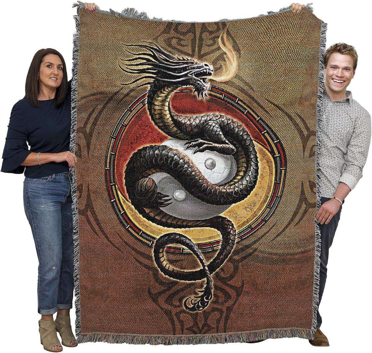 Tapestry blanket with yin yang dragon in earthtones, held by two adults