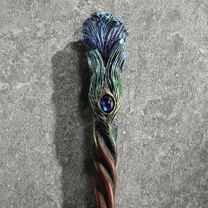 Blue peacock feather wand with gem, closeup of plume and jewel