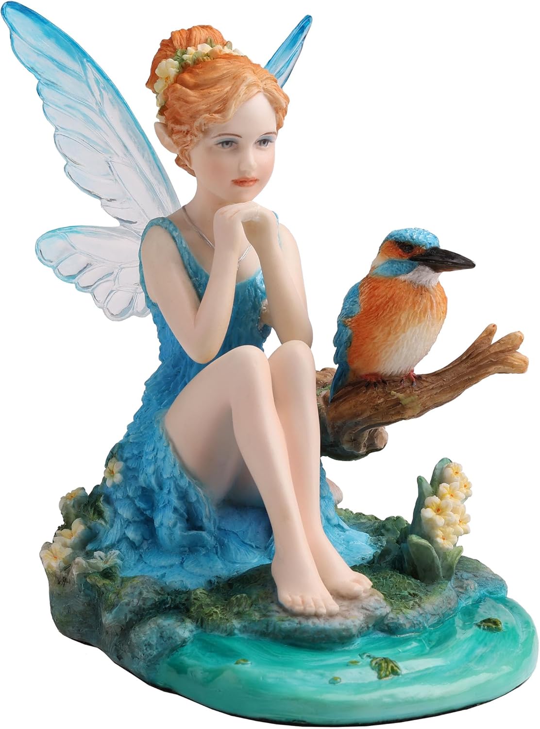 Figurine of fairy in blue dress with matching wings and red hair sitting by pond with kingfisher bird