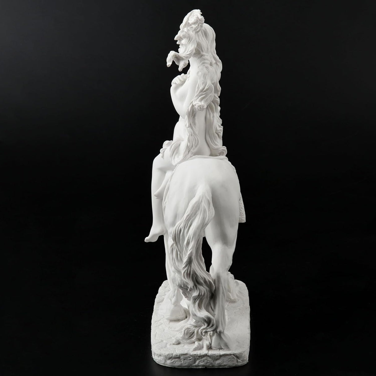 Sculpture of Lady Godiva riding a horse in the nude, clothed in her hair