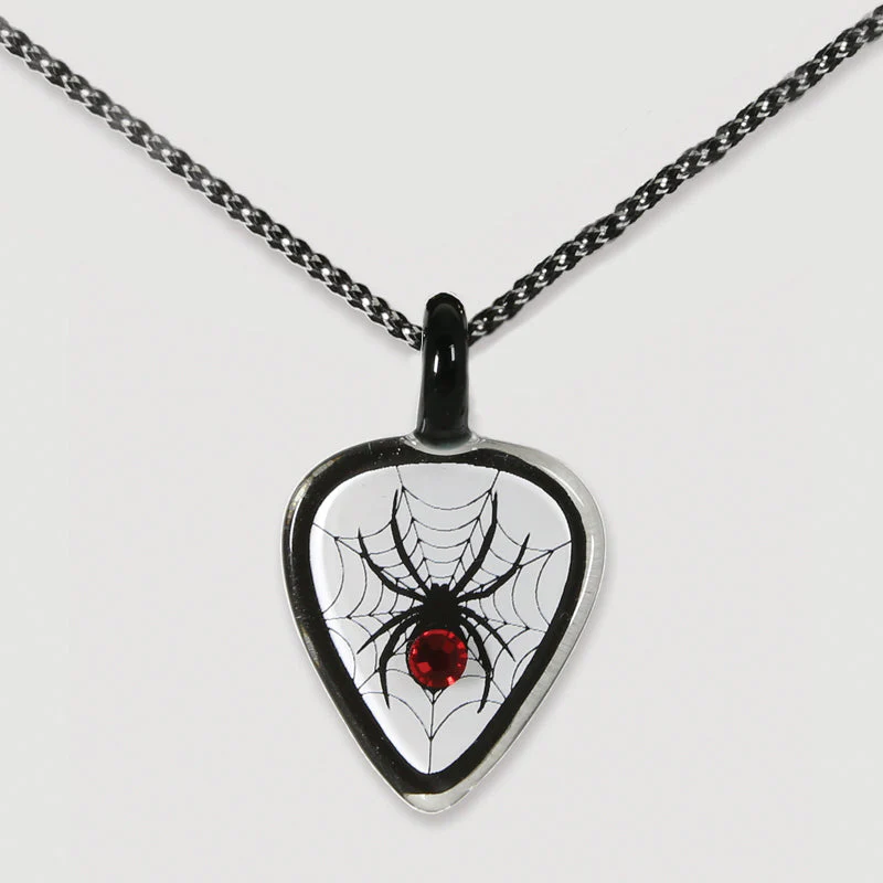 Glass pendant necklace with guitar pick showing spider in web with red crystal abdomen