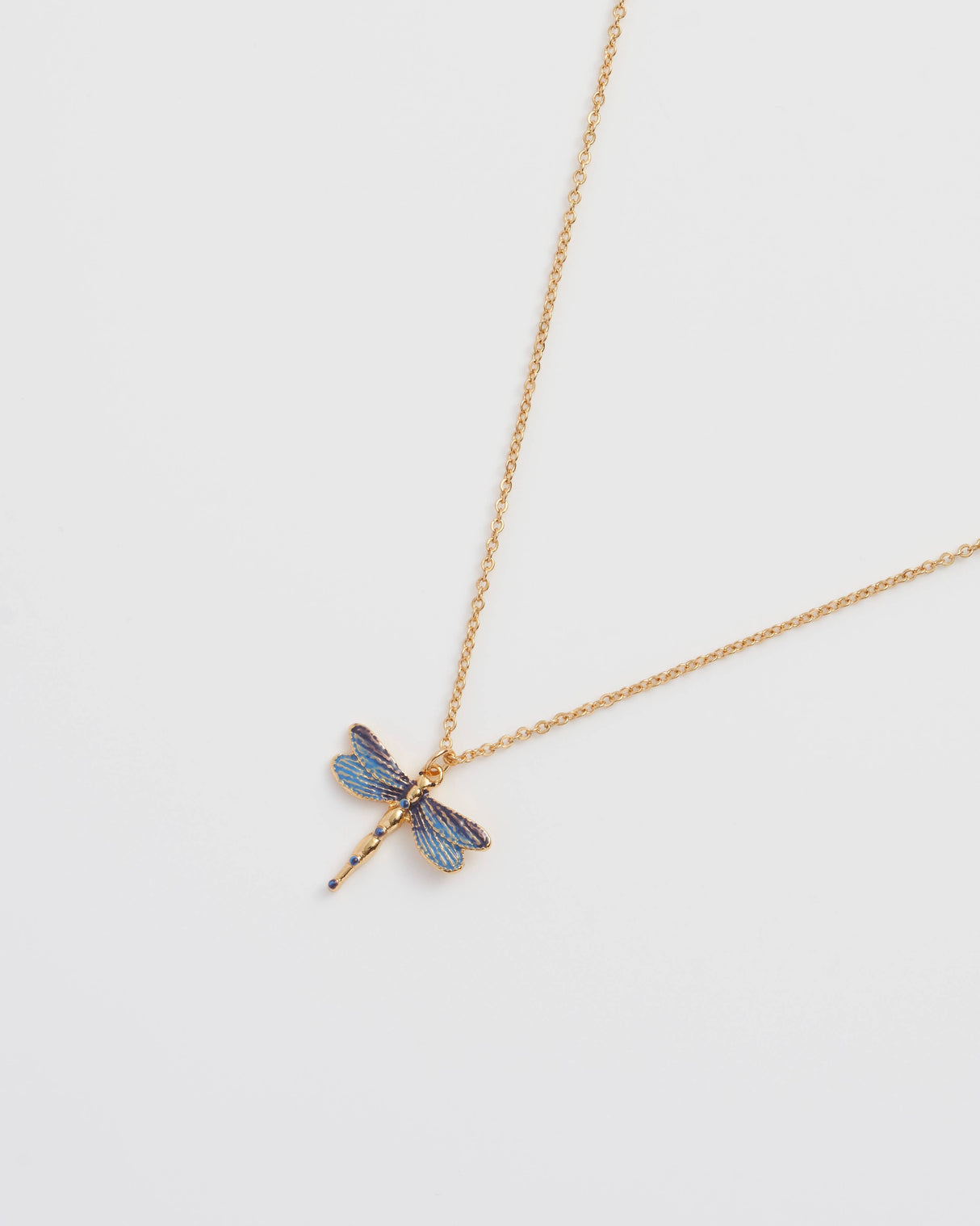 Gold necklace with a dragonfly pendant