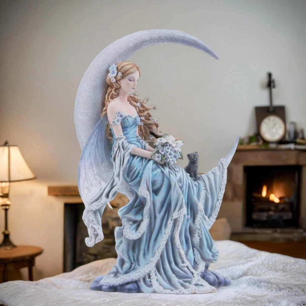 fairy in blue dress with black cat holding flowers sitting on moon in a room