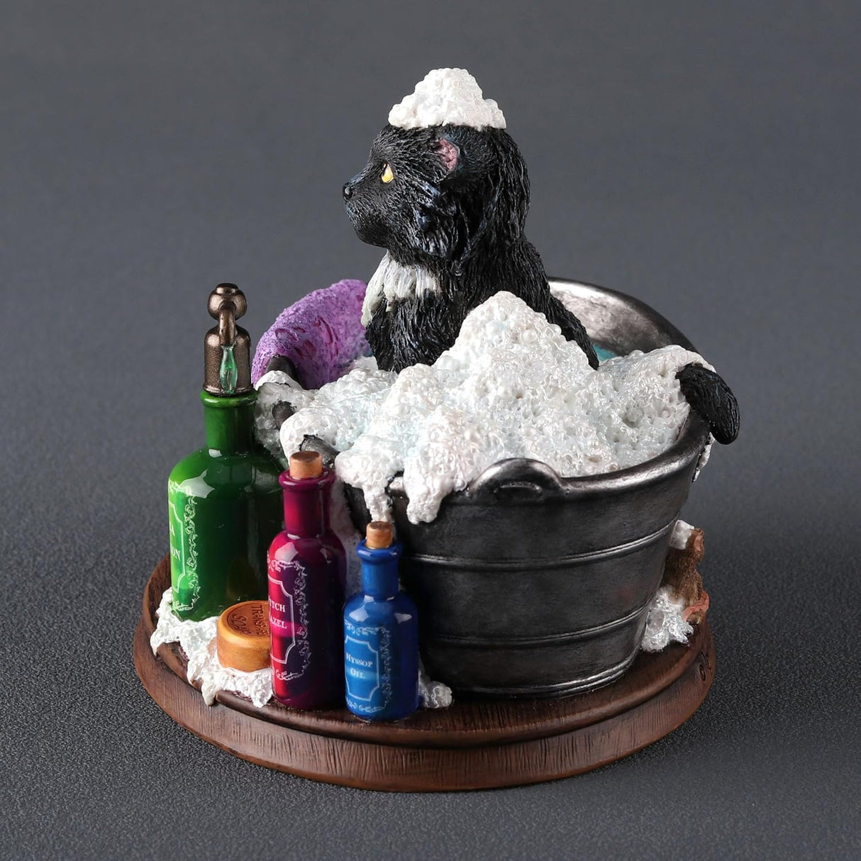 Figurine by Lisa Parker, black and white cat in bubble bath tub with soap bottles, purple towel, mouse at the back
