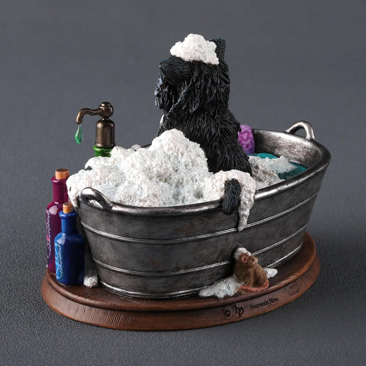 Figurine by Lisa Parker, black and white cat in bubble bath tub with soap bottles, purple towel, mouse at the back