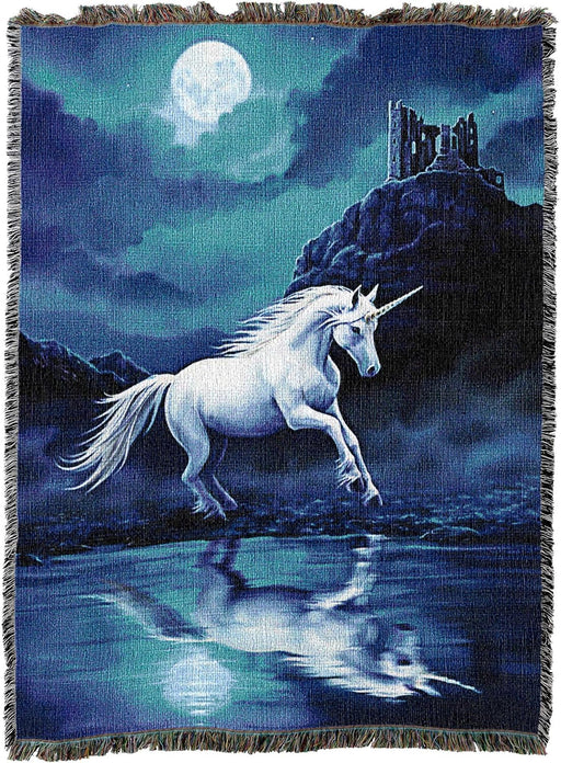 Tapestry blanket of white unicorn running across a beach at night under a full moon, ruined castle in background