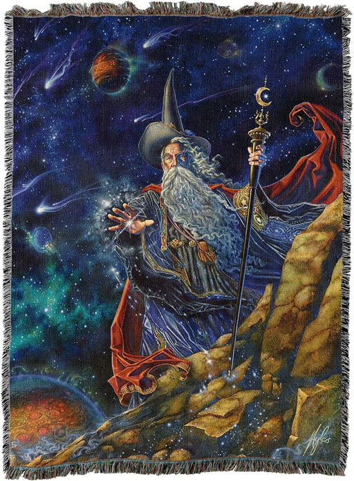 Tapestry blanket of wizard in hat with staff casting a spell as the cosmos and comets are seen beyond him