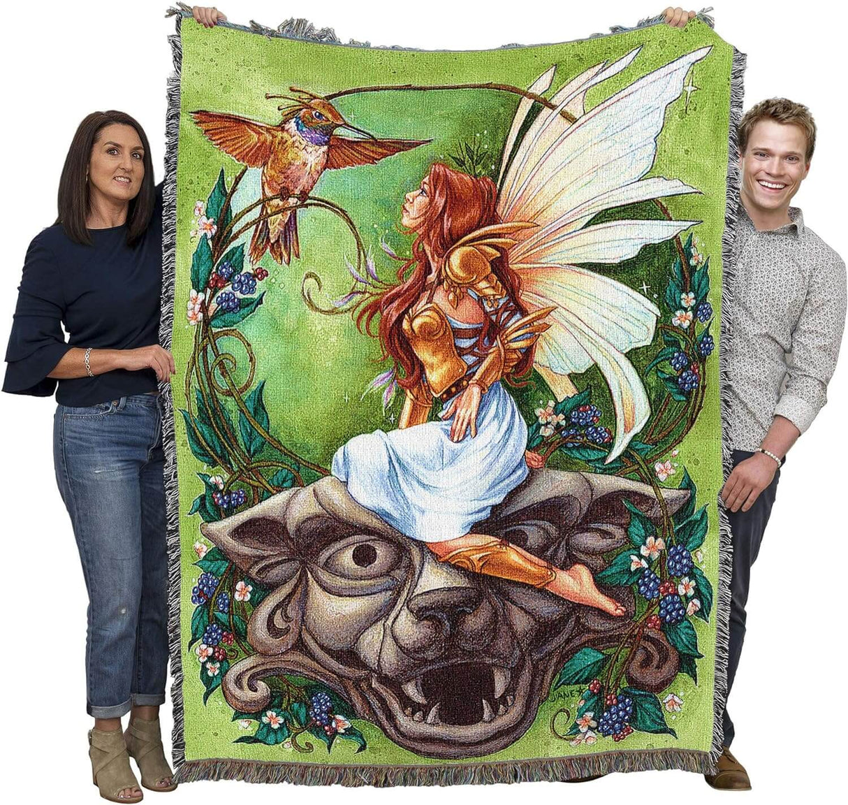Tapestry blanket held up by two adults to show large size