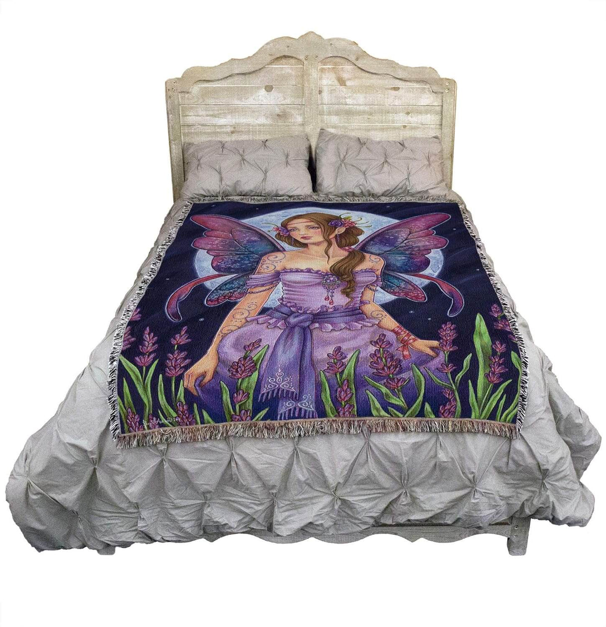Tapestry blanket with art by Brigid Ashwood. Fairy in purple dress with purple-blue wings standing in a flower field with full moon beyond. Shown on a bed.