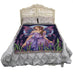 Tapestry blanket with art by Brigid Ashwood. Fairy in purple dress with purple-blue wings standing in a flower field with full moon beyond.  Shown on a bed.