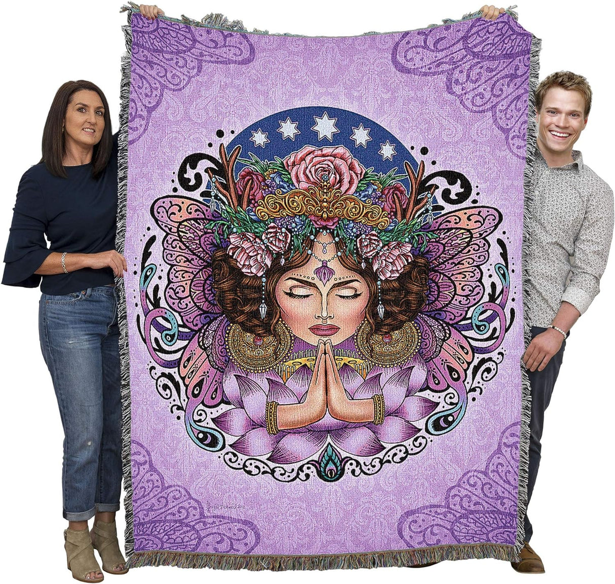 Tapestry blanket held by two adults to show large size