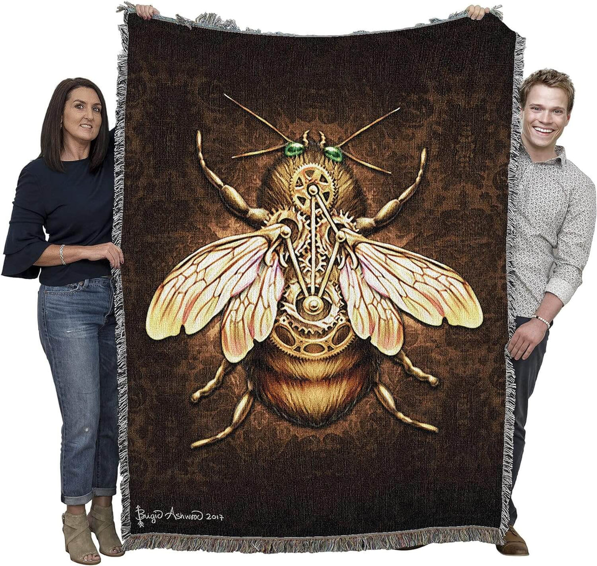 Tapestry blanket held by two adults to show large size