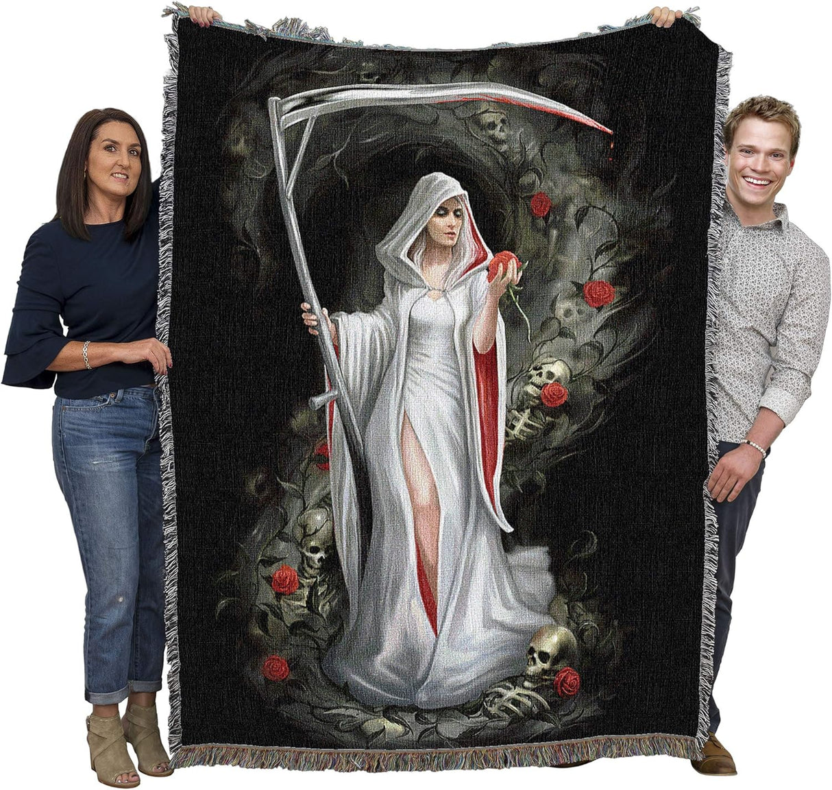 Tapestry blanket held up by two adults to show large size