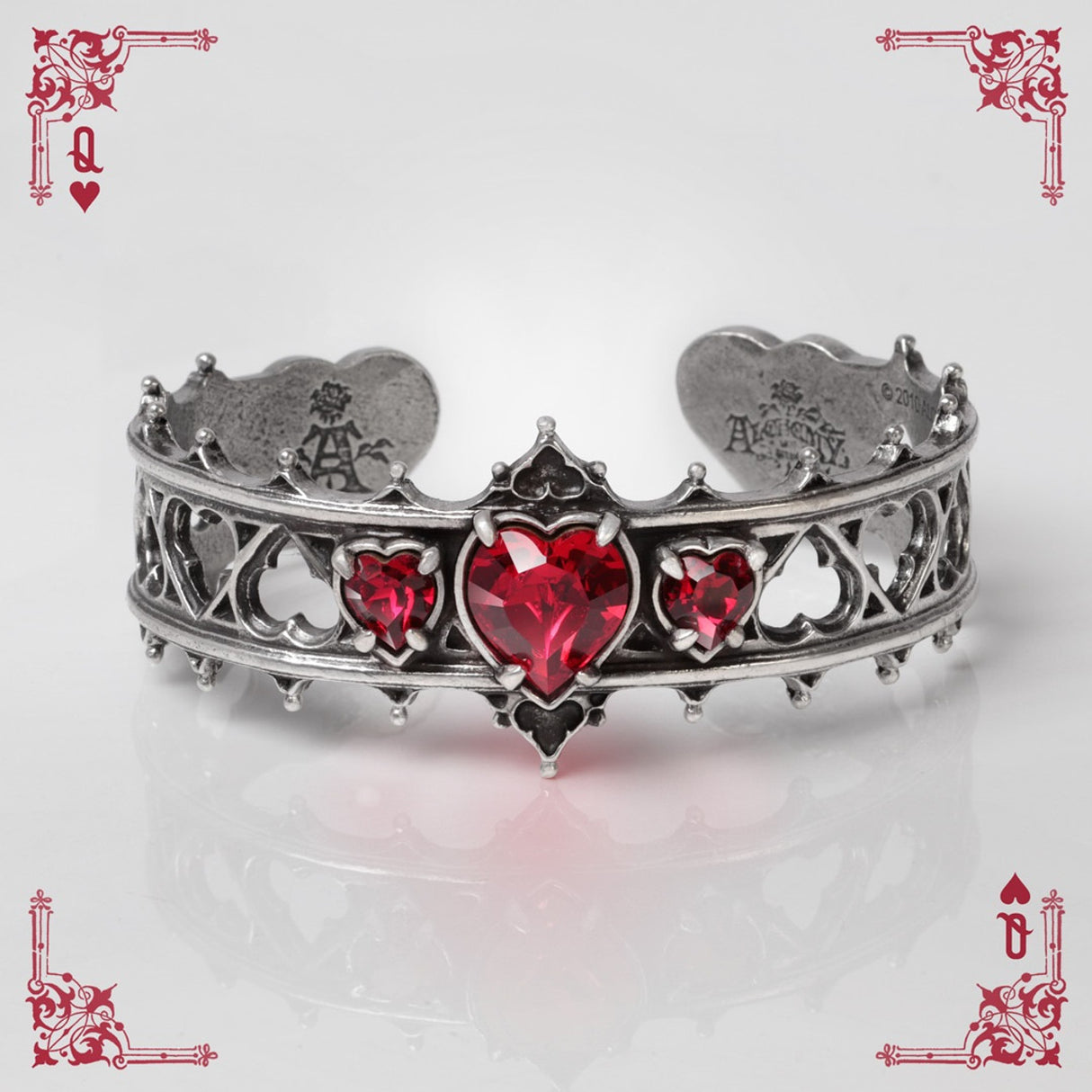 Pewter bracelet with red heart stones on a white background with playing card designs