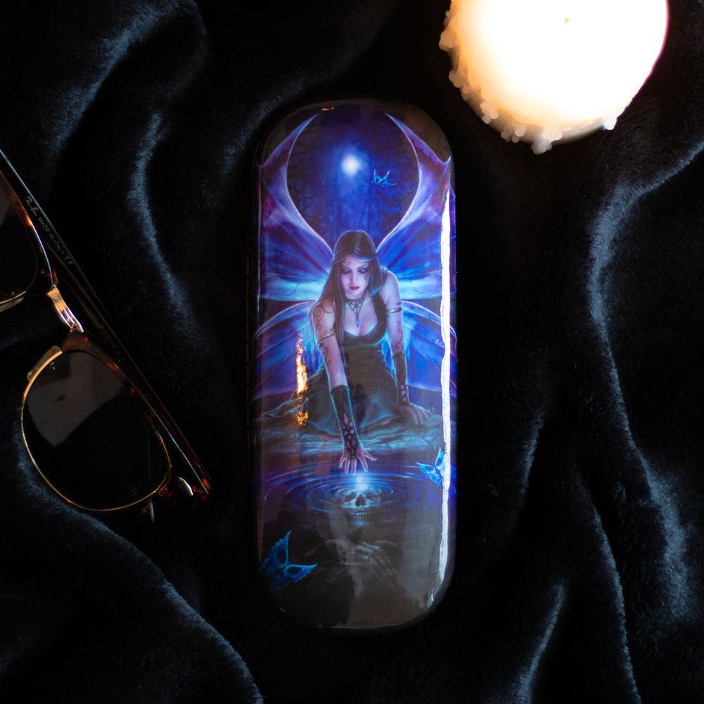 Glasses case with fairy in black dress under full moon reaching for a skull in a pond
