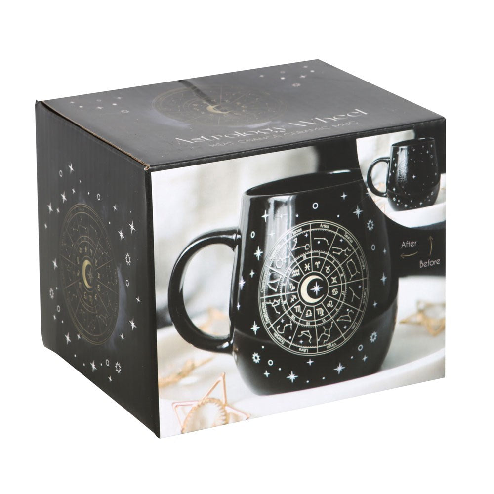 Black ceramic mug with gold astrology wheel that shows up with heat, shown in box