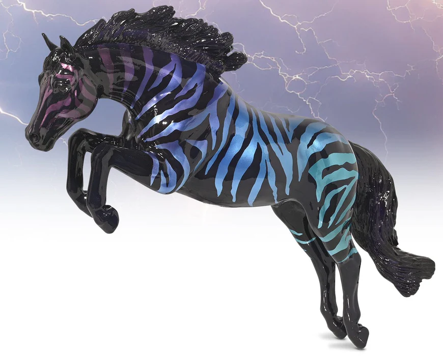 Breyer jumping horse figurine with zebra pattern in gradient purple-blue on black