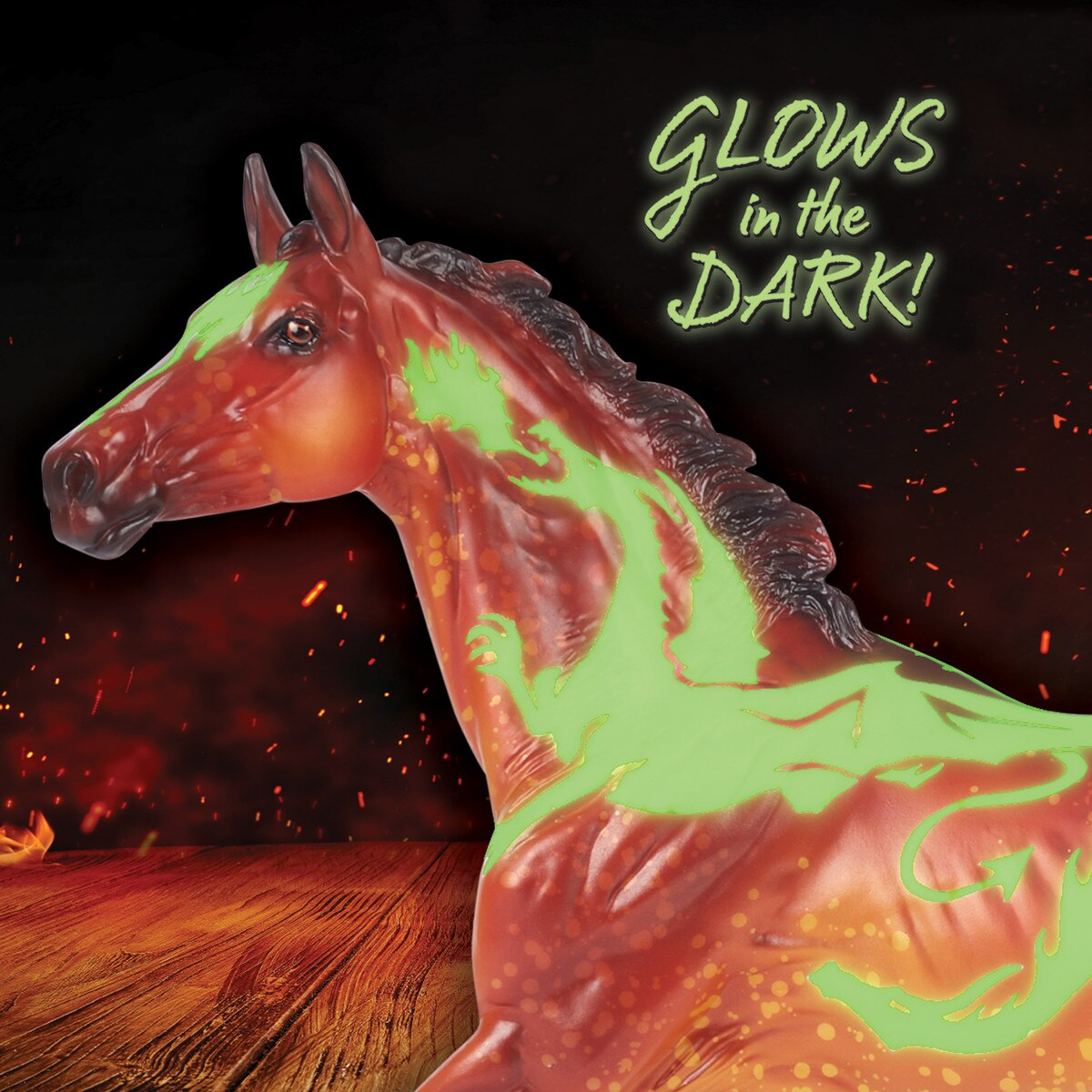 Breyer model horse, fiery orange-red with darker mane, tail & legs, with glow in the dark dragon design