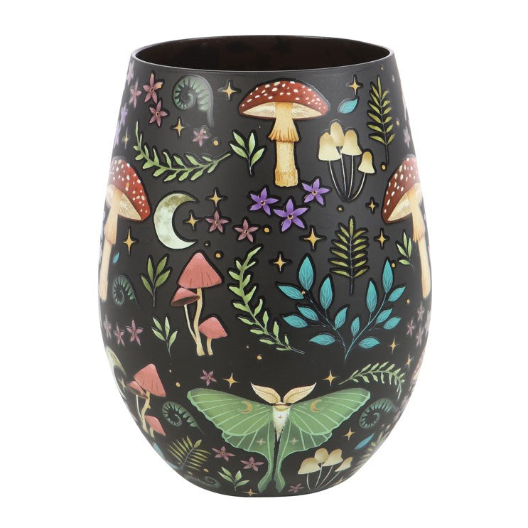 Stemless wineglass with all over patterns on black of mushrooms, ferns, luna moth, moon and stars, flowers