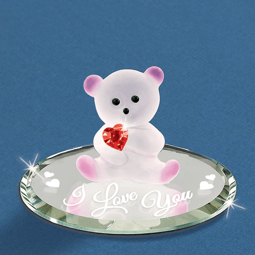 Glass bear figurine holding a red crystal heart on a mirror base that says "I Love You"
