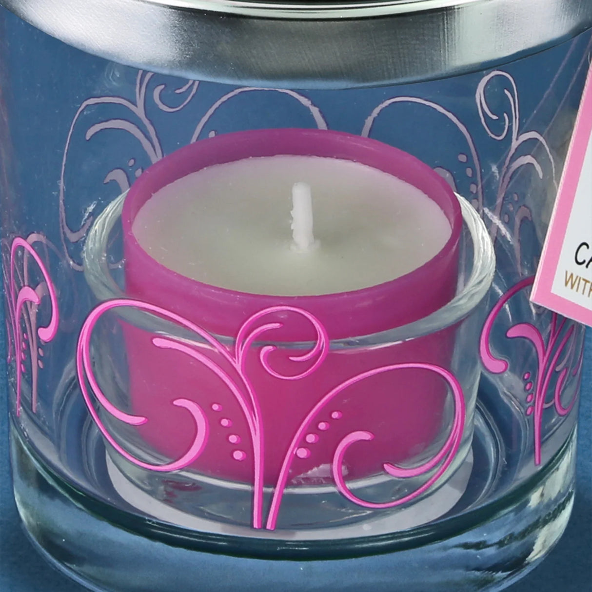 Jar candle holder with pink tealight, on lid is glass rainbow butterfly