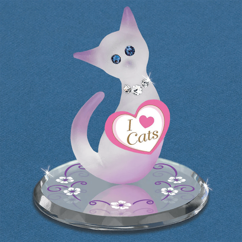 Figurine of a frosted white and pink glass cat with "I Love Cats" tag and crystal eyes and collar on a mirror base decorated with flowers