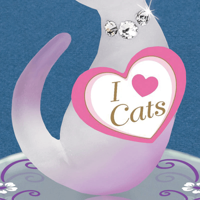 Closeup of cat's frosted glass body with I Love Cats tag and mirror base, crystal collar