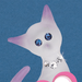 Closeup of glass cat's face with blue crystal eyes and white crystal collar