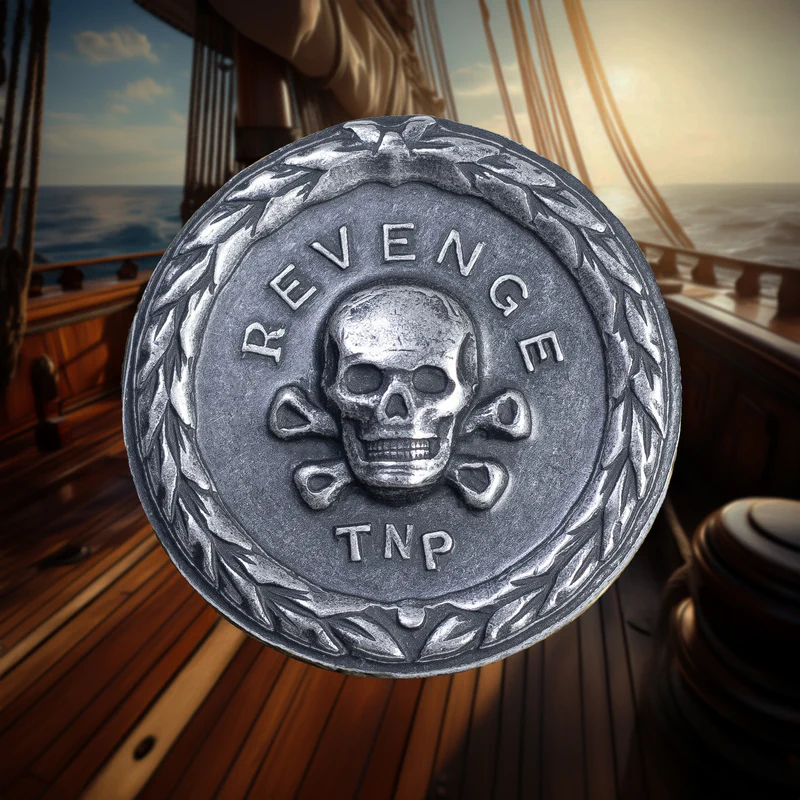 Silver coin with 'REVENGE' and skull design